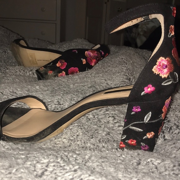 black heels with embroidered flowers